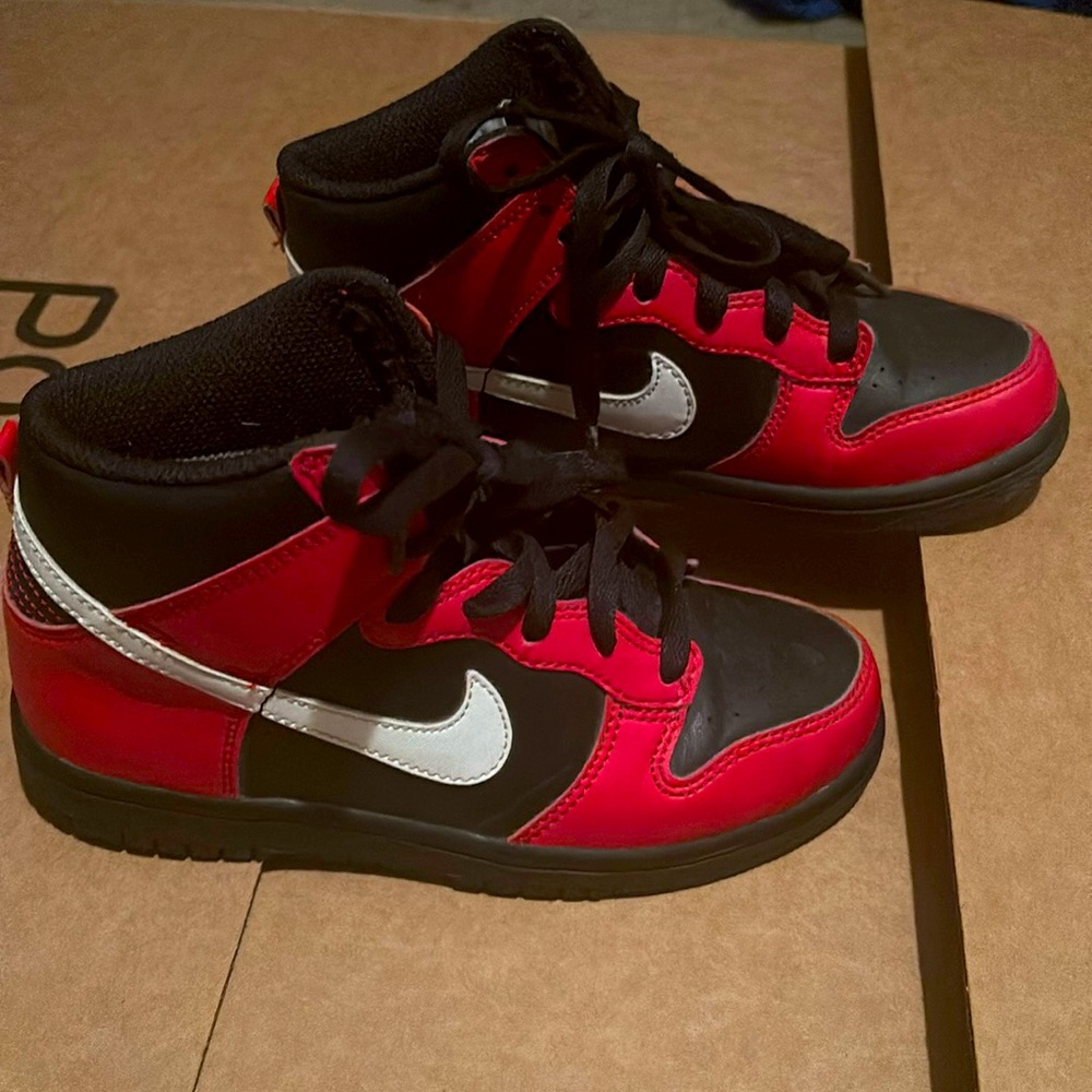Kids red and black Nike dunks